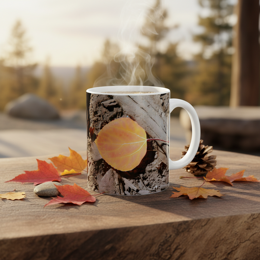 Autumn aspen leaf macro print mug on wooden table with fall leaves and pine cone