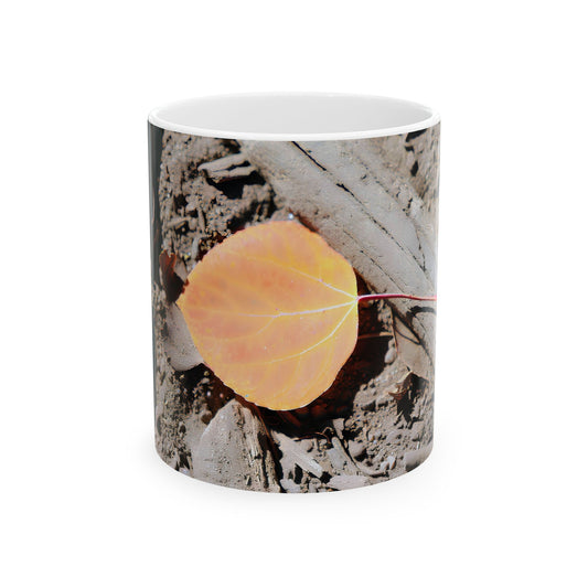 Mug with a macro photo of a yellow aspen leaf on forest floor and bark