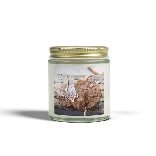 Glass candle with gold lid, featuring macro photo of dried leaf on bark label