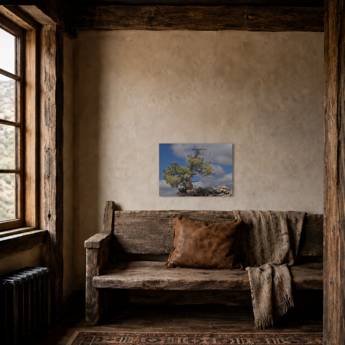 High Country Sentinel hanging in a warm timber-framed room above a rustic bench