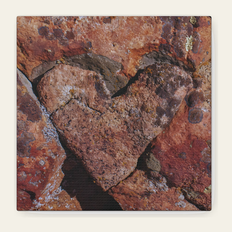 Rock Heart — canvas print of a heart-shaped block held in split red stone, lichen working the edges